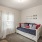Large bedroom with plush floors and a large window