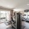 Large fitness center with large windows and plenty of equipment