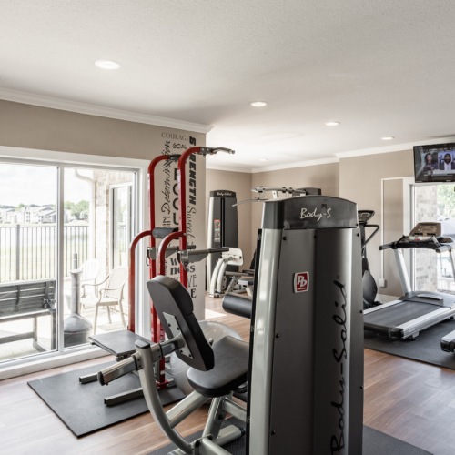 Fitness Center Large fitness center with large windows and plenty of equipment