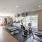 Large fitness center with large windows and plenty of equipment