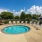 Large hot tub located next to the [pool 